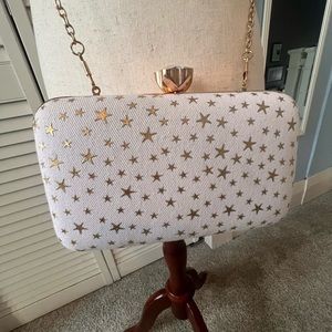 White canvas crossbody/ clutch with gold stars